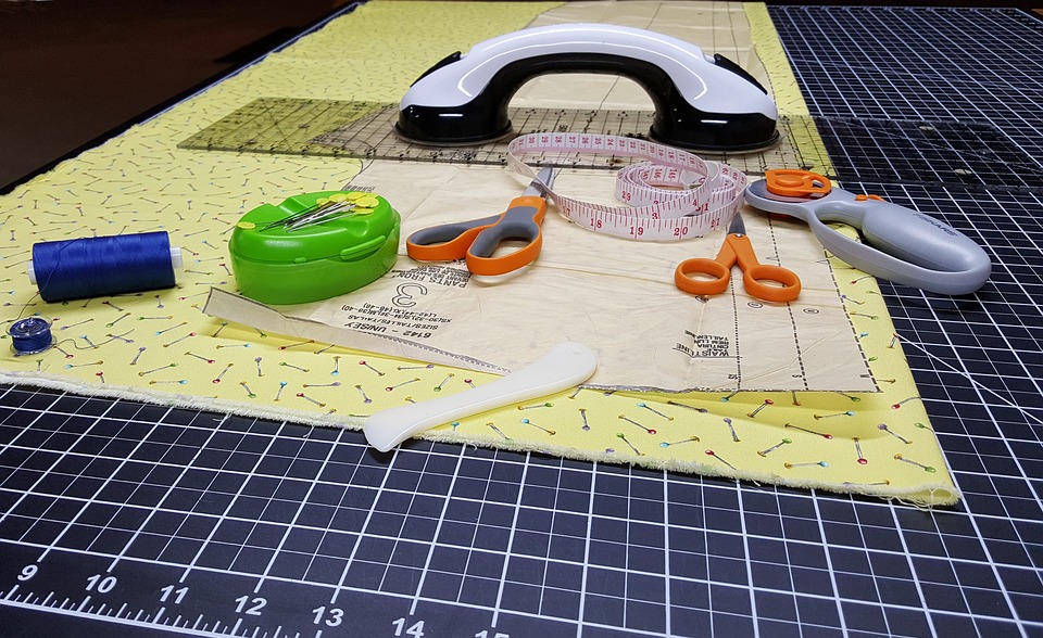 cutter, thread, tape measure and scissors